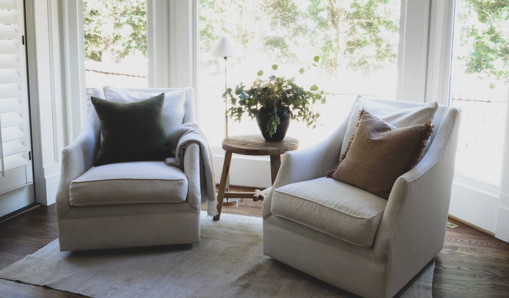Two swivel chairs in front of a window in a new home construction project.