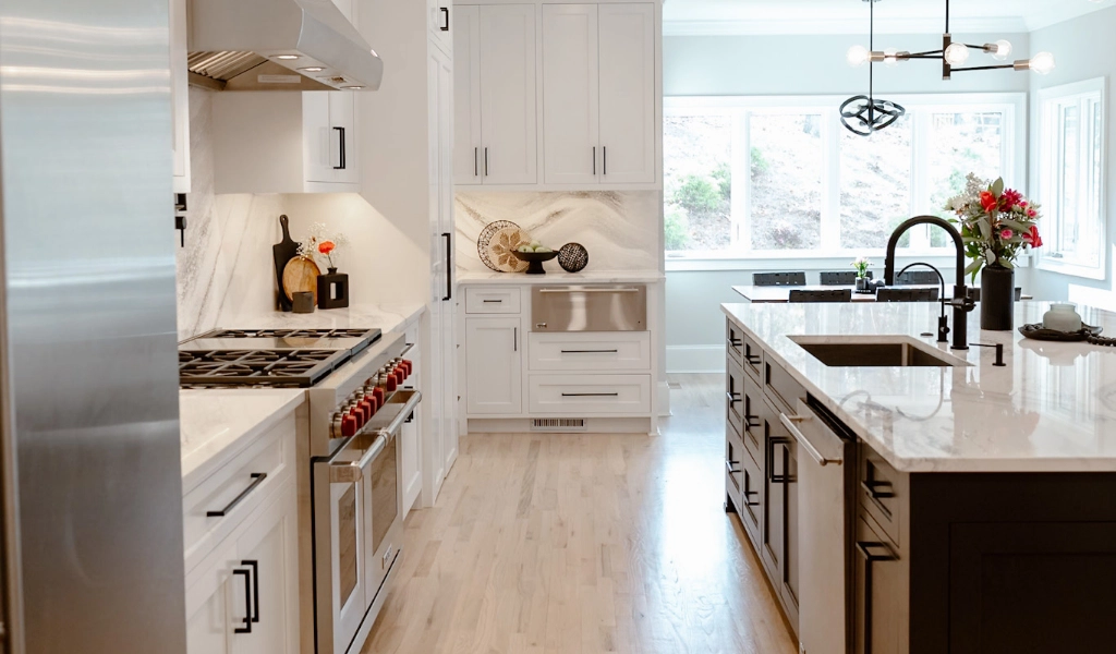 A new home construction featuring white cabinets and stainless steel appliances.