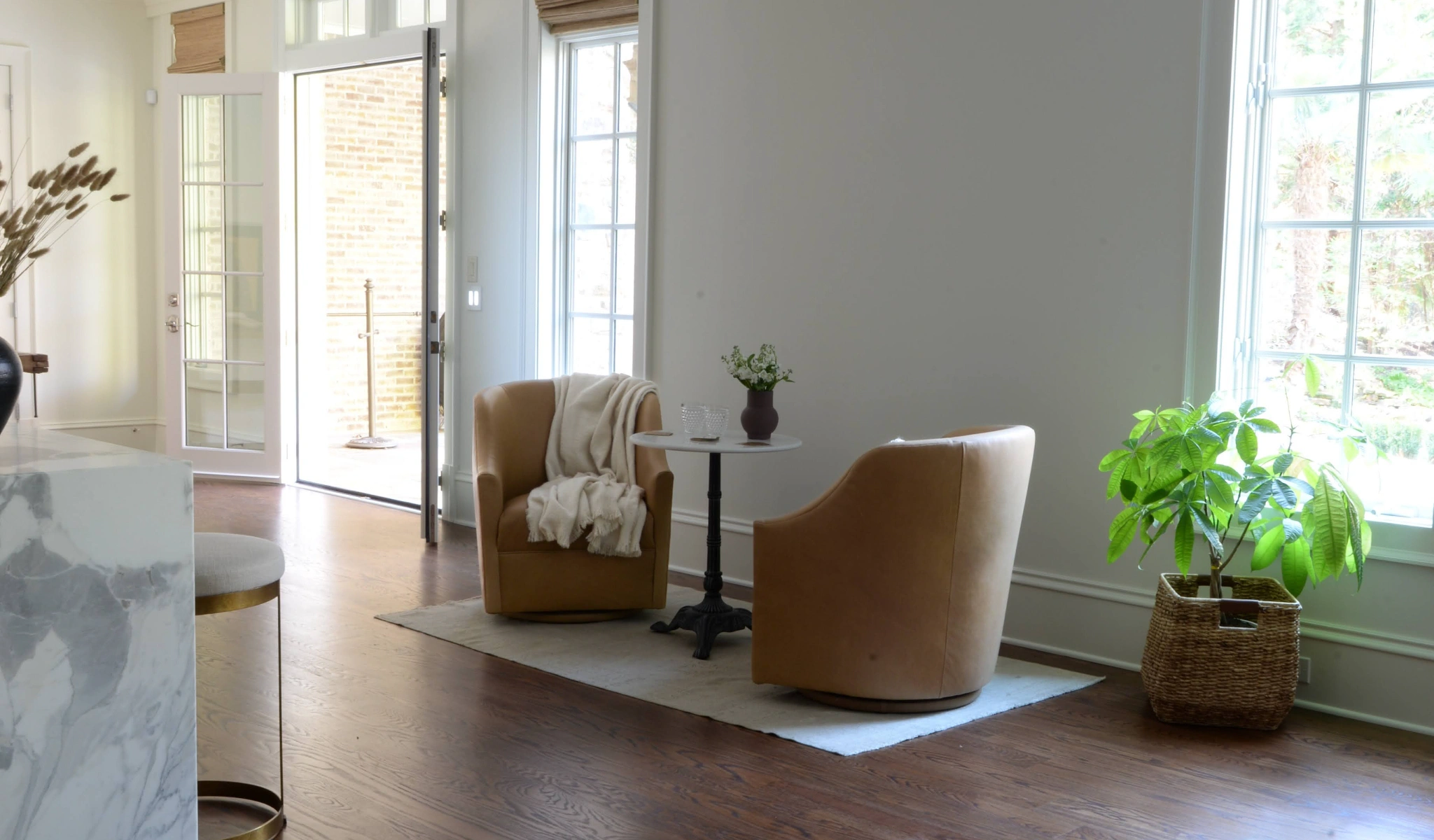 A living room with two chairs and a coffee table.