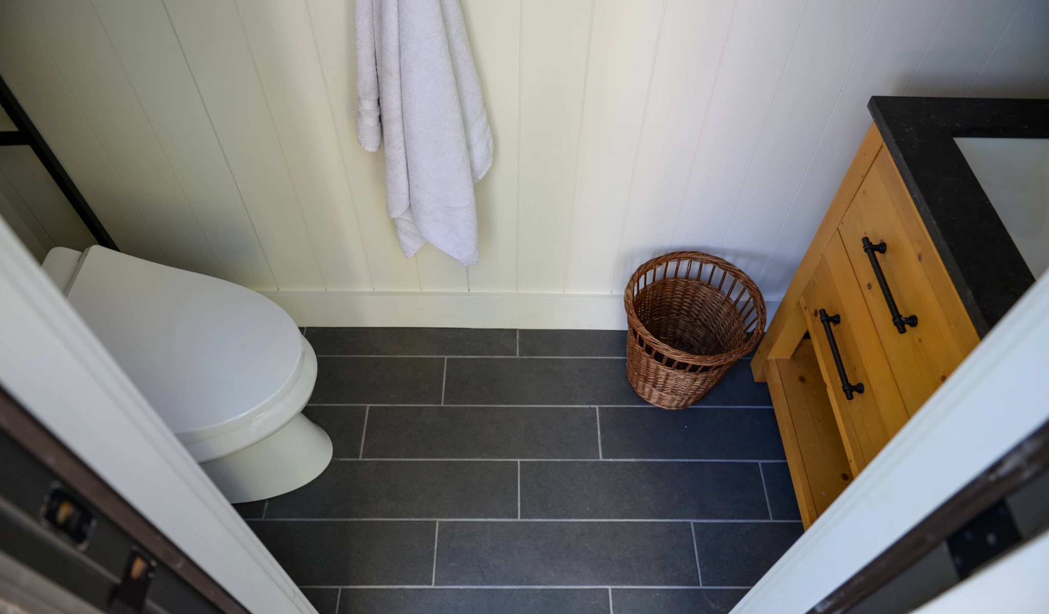 A minimalistic bathroom with new floors.